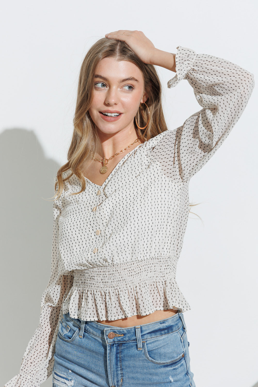 V-Neck Button Down Moon Print Long Sleeve Top with Ruffled Hem Detail