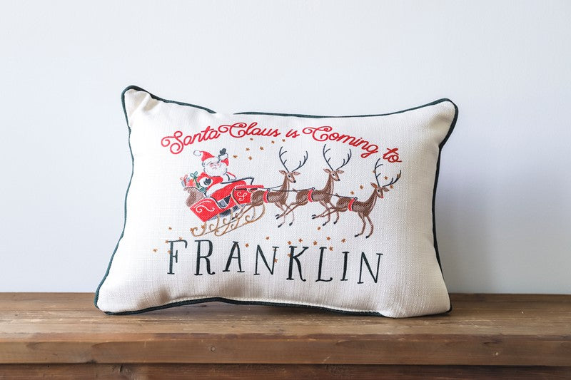 SANTA CLAUS IS COMING TO HOMETOWN SLEIGH PILLOW